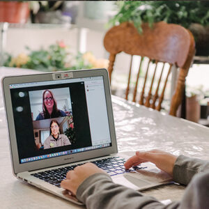 A mentor talking to an intern over a zoom call
