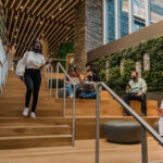 Students standing and sitting on the stairs
