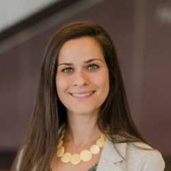A young professional smiling.